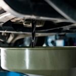 Old,Dirty,Oil,Pouring,From,The,Car,Engine,In,Car